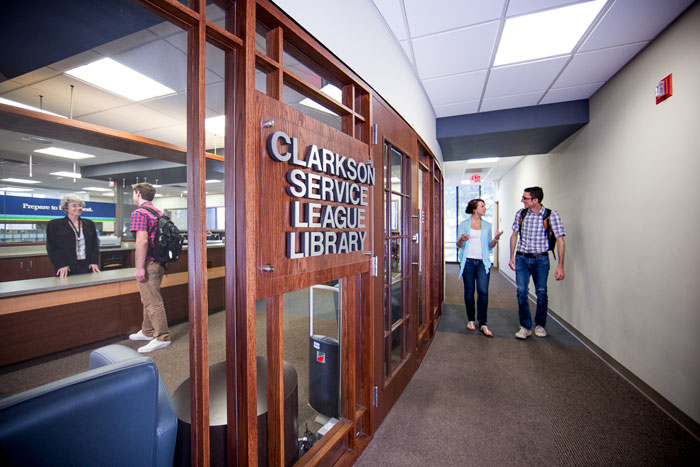 Students walking into the library.